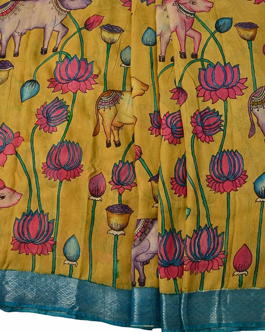 Mustard Chanderi Kalamkari saree featuring hand-painted lotus designs and teal border