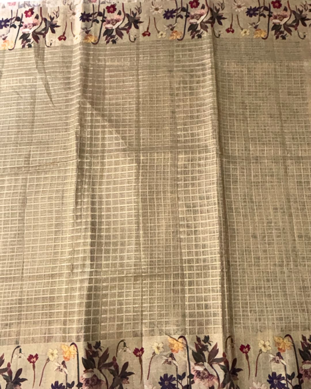 Beige kota doria saree with floral border and pallu