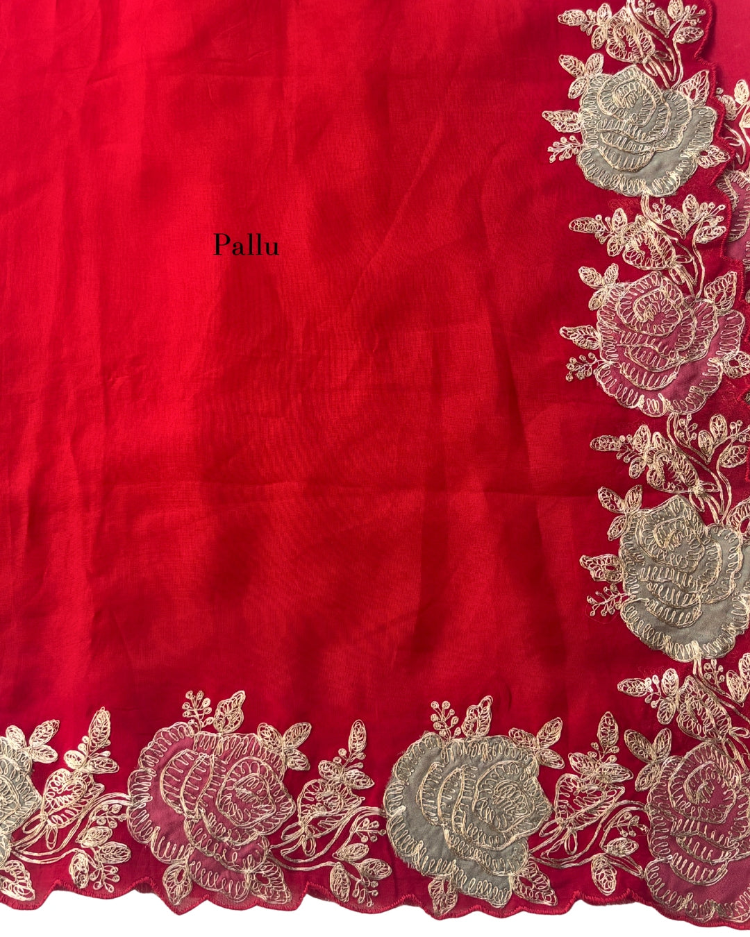 Red Georgette saree with scalloped embroidered floral border and delicate rose threadwork.