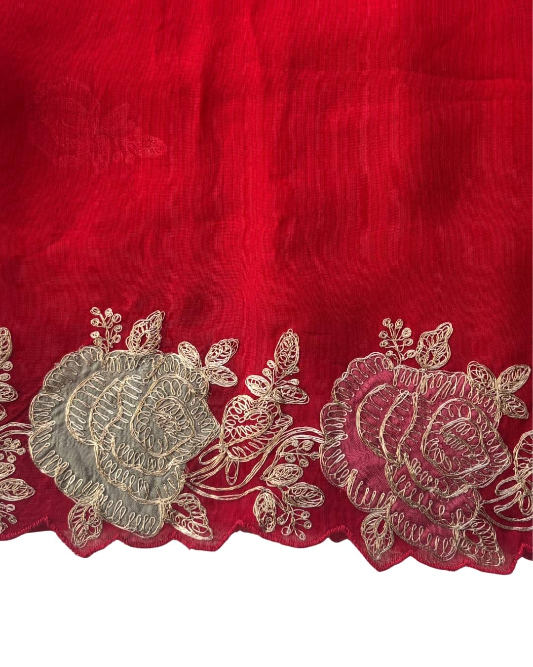 Red Georgette saree with scalloped embroidered floral border and delicate rose threadwork.