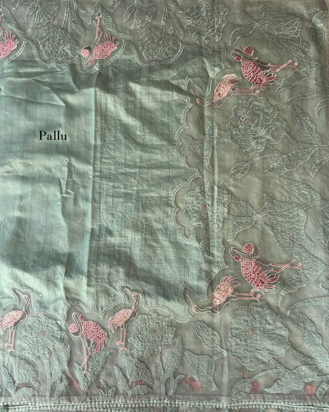 Pastel green applique work saree with a flamingo design